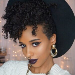 Curly tendrils and a hat hairstyle for black women